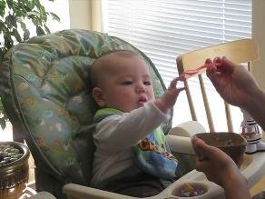Ryan eats solids for the first time