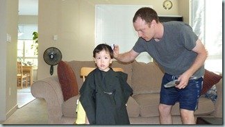 Ryan gets another haircut from daddy