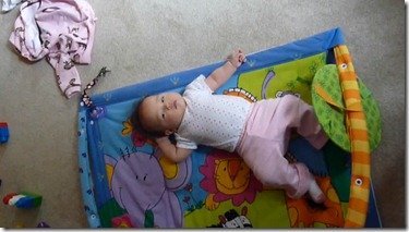 Madeline rolls over (sort of!)